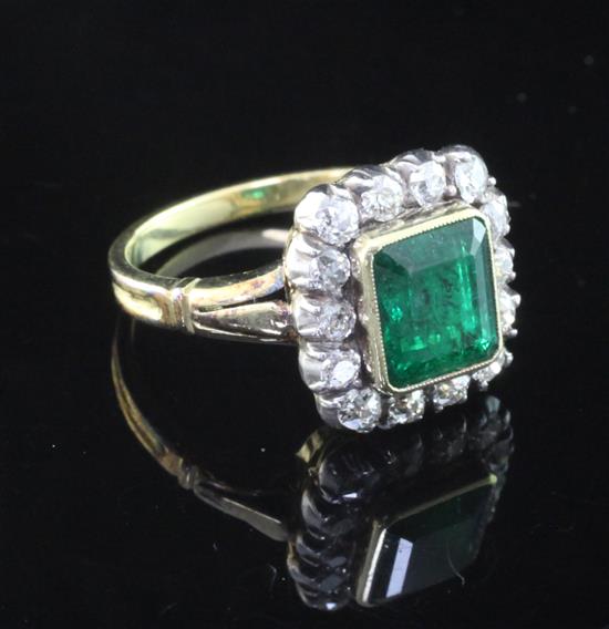 A Victorian style unmarked gold, emerald and diamond set cluster ring, size L.